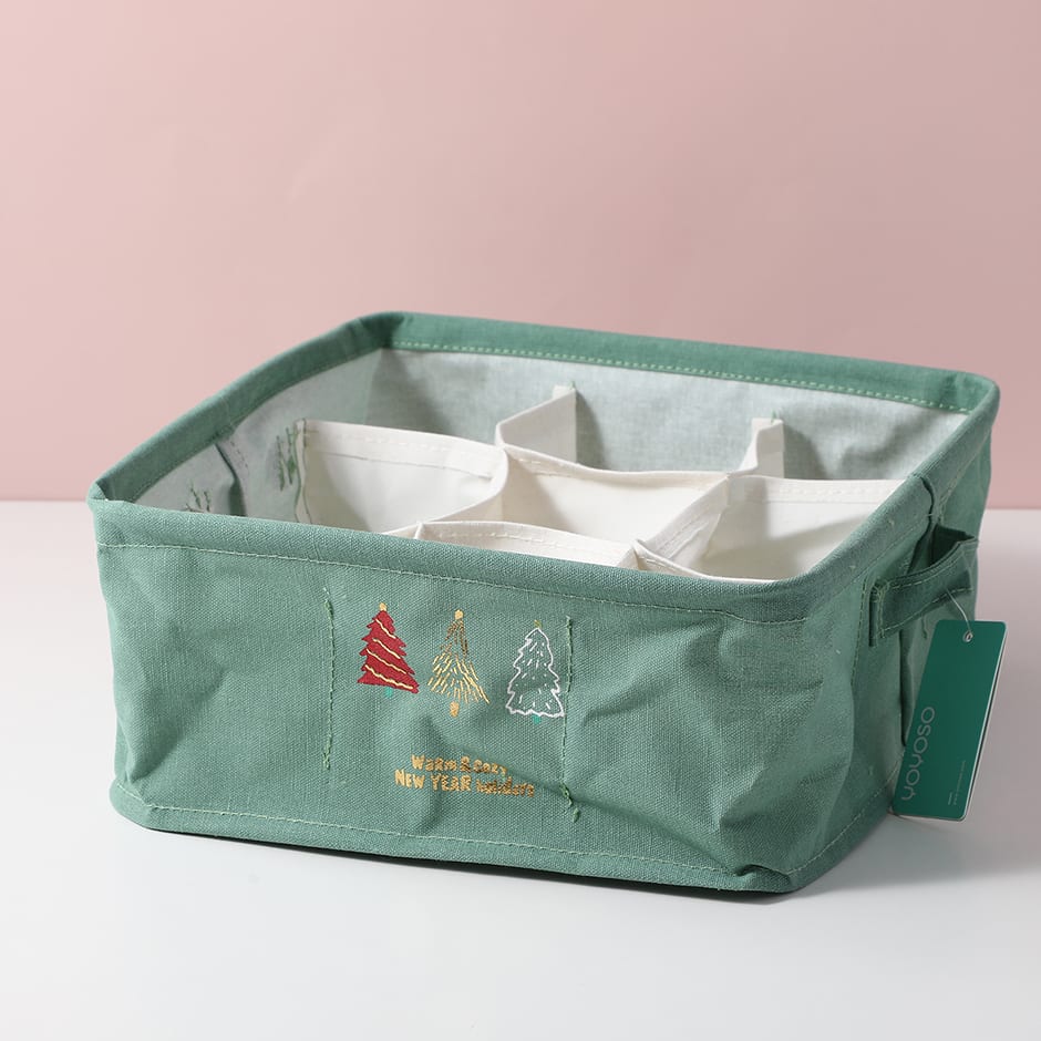 Caja organizadora de tela verde con nueve divisiones y arbolitos bordados