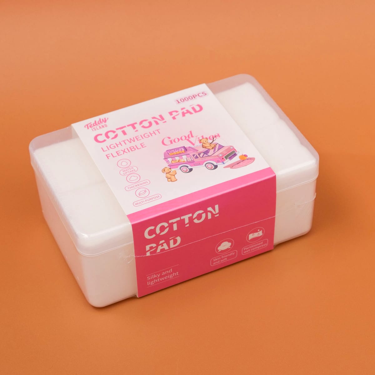 Caja transparente cerrada con faja rosada de Teddy Island y pads de algodón en su interior