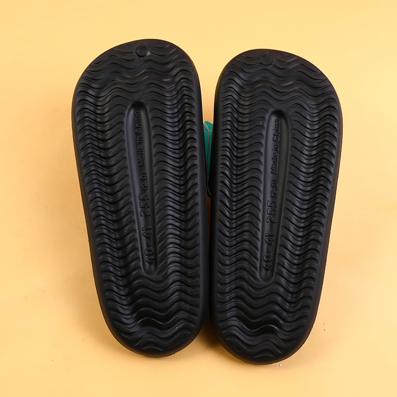 Suela negra con patrón ondulado antideslizante de las pantuflas